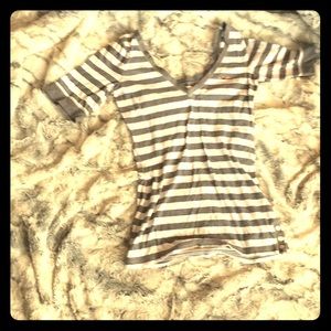 A womens gray and white v neck shirt